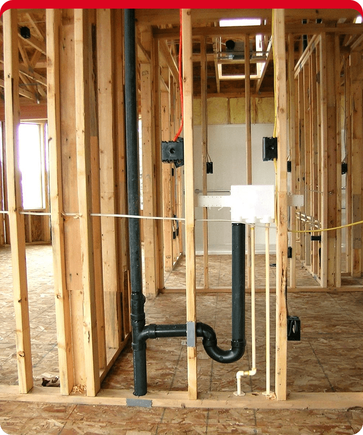 A bathroom with pipes and plumbing in it.