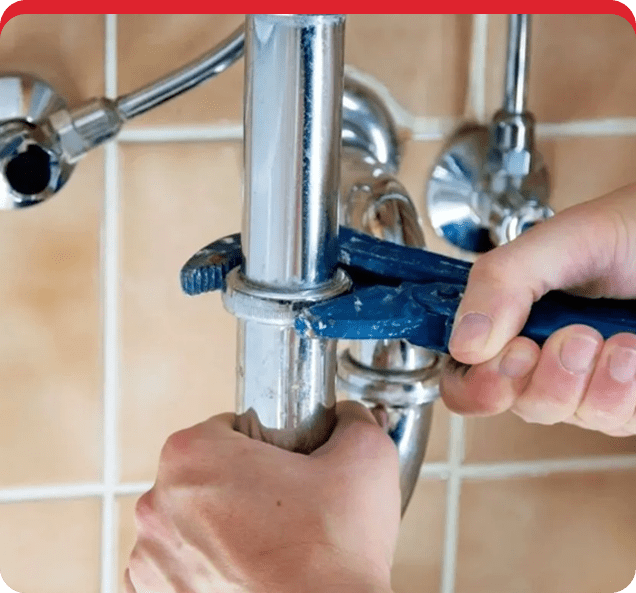 A person is fixing the faucet of a bathroom.